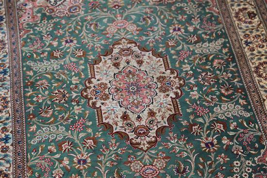 An Isphahan style silk rug, 4ft 9in by 3ft 4in.